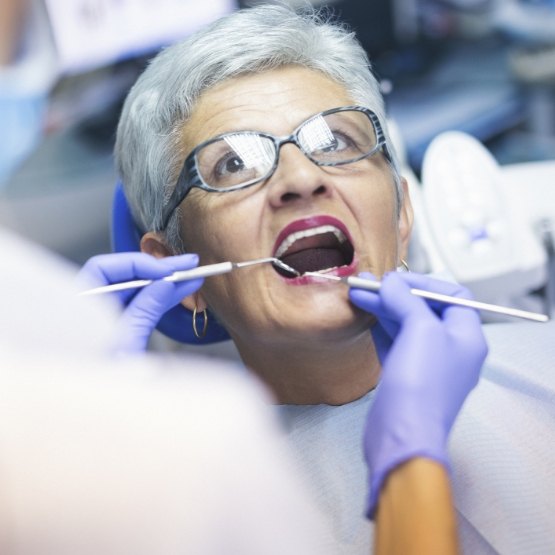 Woman receiving checkup from preventive dentist in Centennial